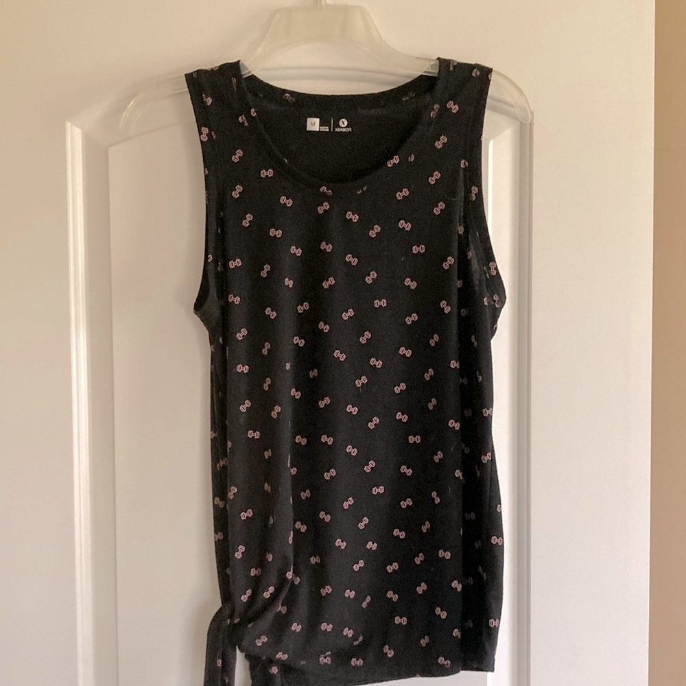 Black workout top with light pink dumbbells. Ties on the side. Super cute!